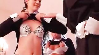 Three girls are having fun with a nun who uses toys