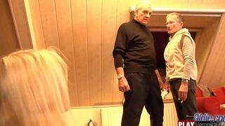 A man with a gray beard has sex with a young woman