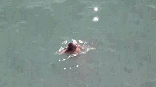 A pair of naked people at sea in HD