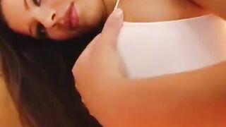 The girl plays with a dildo to achieve her orgasm, showcasing her wet vagina in close-up