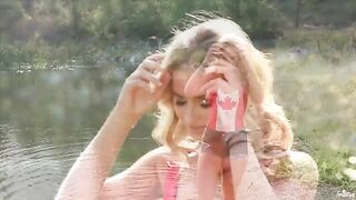 Blonde tenderly wanking her pussy by the lake