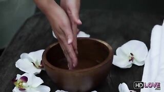 A hot guy massaged the body of a sexy brunette