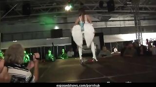 A hot brunette learns how to work with a strip pole