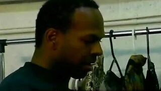 A black guy is having fun with his friend in an intimate way