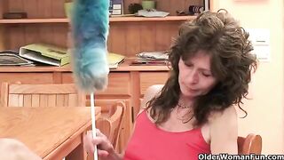 A mature woman plays with her pussy using her fingers