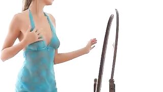 The erotic dance of a beautiful girl in front of the mirror