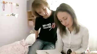 A girl is having fun with her classmate at home, exploring new sensations