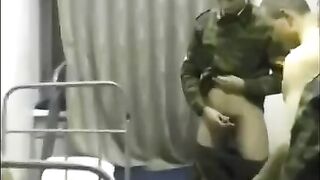 A chick is being fucked by soldiers in the crowd in the barracks
