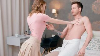 Two naked lovers chat and cuddle on the bed
