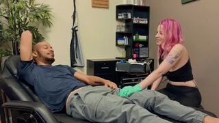 A sexy girl with tattoos is having fun with a nice man