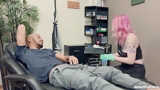 A sexy girl with tattoos is having fun with a nice man