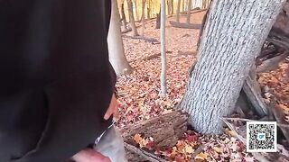 A couple enjoys sex while taking a walk in the park