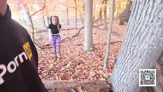 A couple enjoys sex while taking a walk in the park