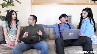 A couple of cute girls threw a surprise party for their stepfather on the couch