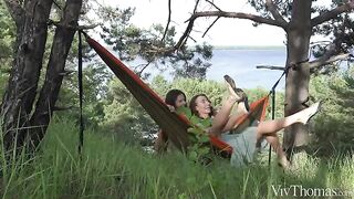 A girl gets a tan in the crotch from her girlfriend in nature