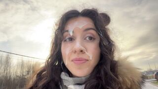 A man has a cum shot on his face while walking