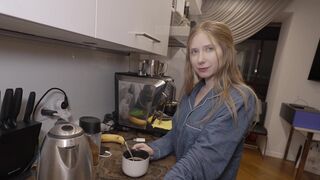 A sexy girl prepared breakfast for her lover in the kitchen