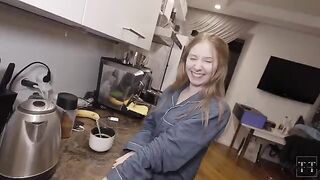 A sexy girl prepared breakfast for her lover in the kitchen