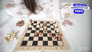 The girl is not upset that she lost the chess game