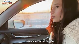 A girl knows how to keep warm during a journey in a car