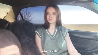 A beautiful girl played with her tongue in a steamy car scene