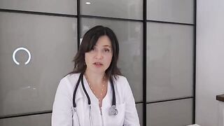 A happy patient has a huge ball of happiness under her blouse