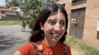 A crazy girl is having fun with strangers on the street