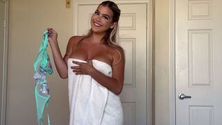 She gets rid of her clothes just like a candy wrapper