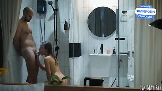 A couple enjoys an intimate moment right after taking a shower together