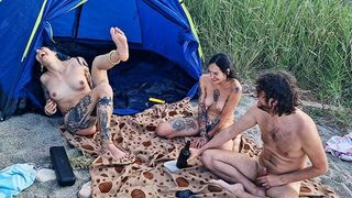 Two girls are having sex in the woods after playing a game