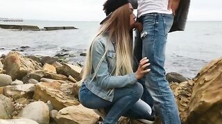 A blondie is giving a blowjob to her boyfriend on the beach in this hot video
