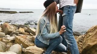 A blondie is giving a blowjob to her boyfriend on the beach in this hot video