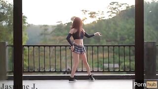 The cute girl Jasmine J pees and fucks with a machine on the balcony